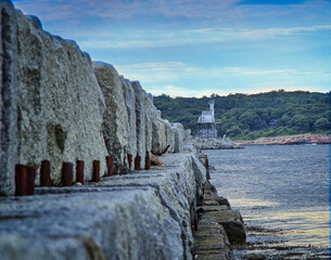 Wall Mural - A beautiful view of the breakwater at Harbor lighthouse, Gloucester, Ma