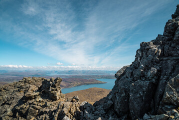 mountainous pass with a view towards mountain ranges