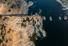 Aerial View Of Puente Ayuda, A Collapsed Stone Bridge Crossing The Guadiana River, Spain.