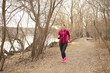 © Marko - Healthy female running on a beach during a beautiful morning
