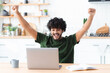 © kucherav - Happy young indian man looking at computer screen making yes gesture, happy with great news, received a nice message in the mail, celebrates success