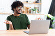 © kucherav - Cheerful Indian young male chatting online using laptop, video call, conference. Happy man communicating online and smiling