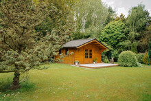 Small Cottage In The Countryside. Garden House Made Of Wood. Cottage In Your Own Garden For Hobbies And Free Time During The Pandemic. Shed In A Large Garden In Germany