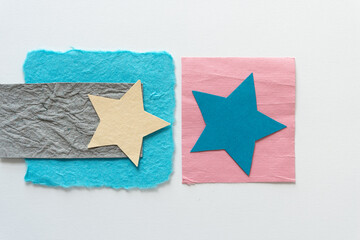 two stars and paper on a light background