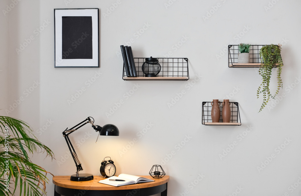 Stylish interior of minimalist room with modern workplace, closeup