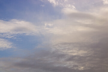 Wall Mural - a mesmerizing shot of the cloudy sky during the day - perfect for wallpapers