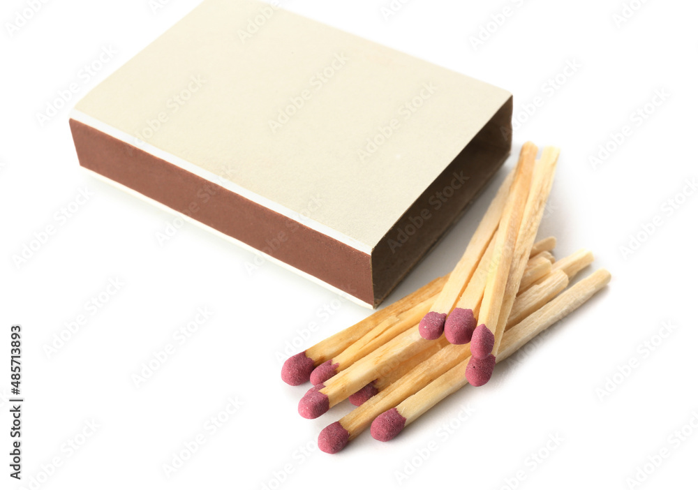 Matches and matchbox on white background
