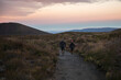 © Matthew - Hikers starting the Tongariro Alpine Crossing Trek at sunrise, Tongariro National Park, North Island, New Zealand