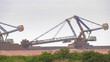an iron ore stacker loader in operation at port hedland