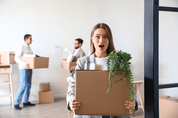 Sticker - Surprised young woman holding box with personal things in office on moving day