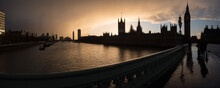 Houses Of Parliament (Palace Of Westminster) And Big Ben Silhouetted At Sunset, Seen From Westminster Bridge, London, England