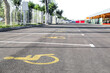© Pixel-Shot - Empty parking space reserved for people with disability