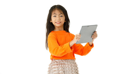 Full body cutout isolated studio shot Asian young primary schoolgirl model in casual outfit standing holding touchscreen tablet computer waving hand say hi greeting via video call on white background