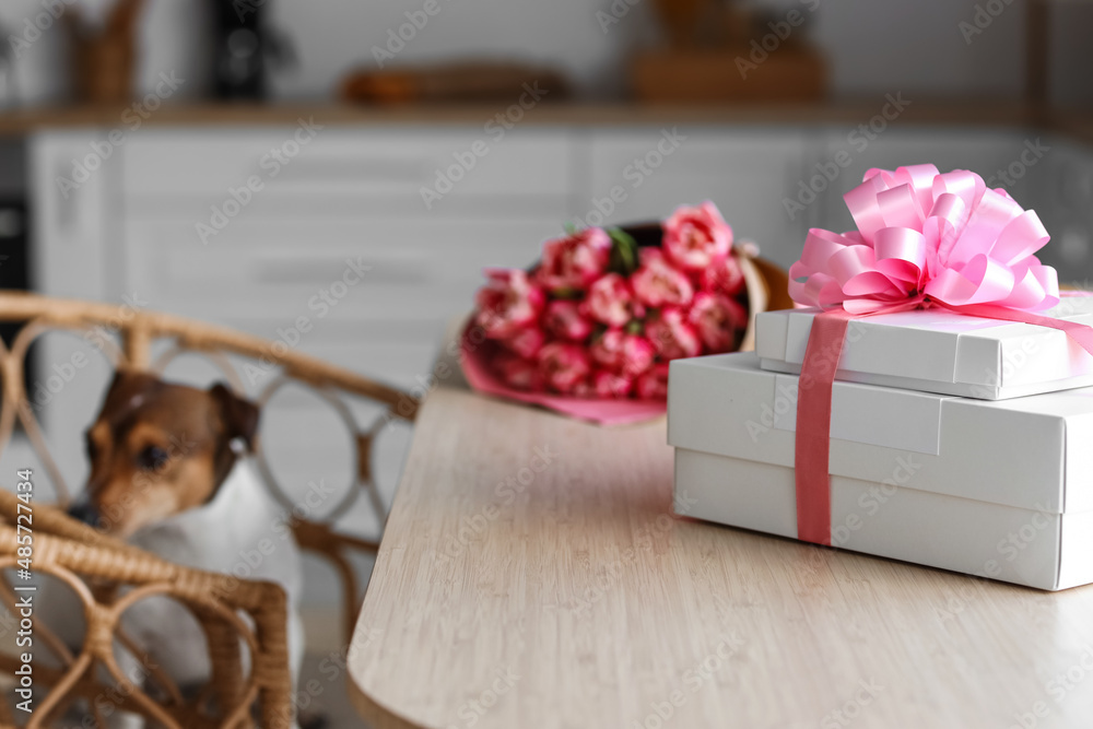 Gift boxes for International Women's Day celebration on dining table, closeup