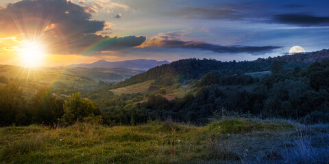 Wall Mural - day and night time change concept above mountainous countryside landscape. pastures and rural fields