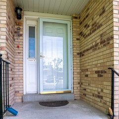 Wall Mural - Square Front door of a house with bricks and metal railings