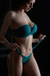 Sensual wet woman in blue bikini set