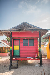 Wall Mural - Rasta (Rastafarian) coloured beachfront accommodation at Sungai Pinang, near Padang in West Sumatra, Indonesia, Asia