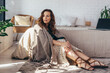 © undrey - Young beautiful woman sitting on floor near bed at home