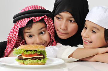 Wall Mural - Arabic family children with hamburger