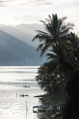 Wall Mural - Fishing boats on Lake Toba (Danau Toba) at sunrise, North Sumatra, Indonesia, Asia