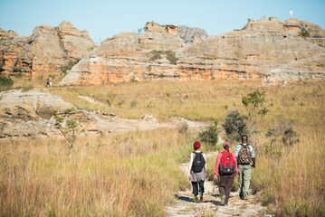 tourists hiking in isalo national park, ihorombe region, southwest madagascar