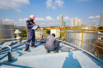 Poster - Male two worker are for inspection ultrasonic thickness roof plate dome top