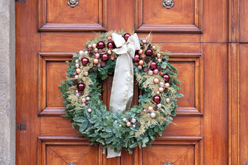 Old wooden door with vintage handle and decorations