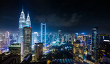 Fototapeta Miasto - Panorama aerial night view of Kuala Lumpur city skyline. Malaysia. Blue mode