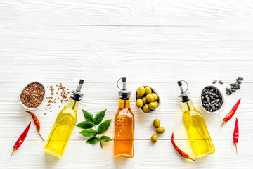 Wall Mural - Different kind of cooking oil - sunflower olive and sesame oil with seeds