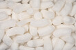© Nynke - Full frame macro shot of white polystyrene packaging material in pellet shape
