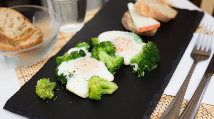 breakfast of crumpled eggs with broccoli