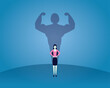 Strong woman concept, businesswoman with strong big muscle shadow