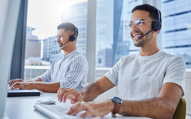 Fototapete - We can achieve more together. Shot of two business colleagues working together at their desks in their office.