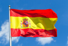 Spain National Flag On Blue Sky Background