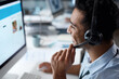 © Nicholas F/peopleimages.com - The first choice in customer care. Shot of a young man using a headset and computer in a modern office.