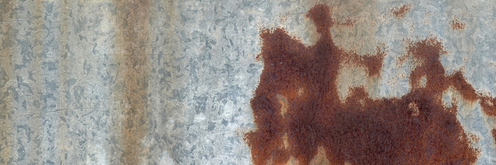 The surface of the old iron has rusted and peeled off. Rust stains on galvanized sheets. Abstract background for decorative and work design.