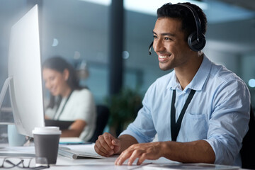 Poster - Where would we be without loyal customers like you. Shot of a young man using a headset and computer in a modern office.