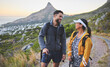 © Kirsten Davis/peopleimages.com - Hiking my favourite trail with the person I adore. Shot of a young couple hiking at sunset on a mountain range outdoors.