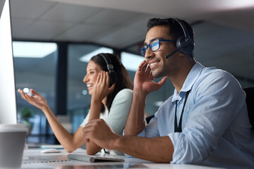 Aufkleber - Call us anytime to get it done. Shot of a young man using a headset and computer in a modern office.
