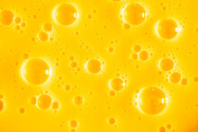 Orange Juice. Bubble Yellow Texture Background. Berry Gel To Cleanse The Skin Of The Face And Body. Spa Treatments, Skin Care. Bath Foam, Detergent. Gold Slime