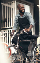 Sticker - Im the citys best bike salesman. Shot of a handsome young man moving a bicycle from his shop during the day.