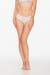 © LIGHTFIELD STUDIOS - cropped view of barefoot woman with slender legs on white background