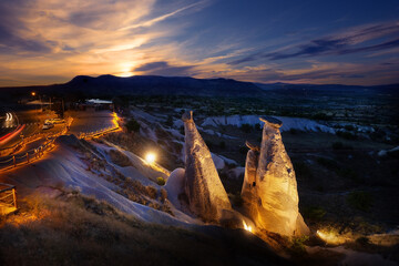 Wall Mural - view of symbol of cappadocia fairy chimneys illuminated by lanterns at sunset