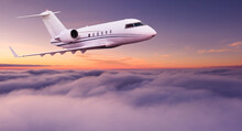 Private Jet Plane Flying Above Clouds In Beautiful Sunset. Shot From Front View