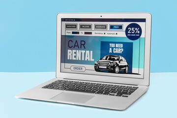 Poster - Laptop with open page of car rental site on color background