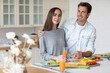 © BestForYou - Portrait young couple smiling and hugging in the kitchen great time together in the kitchen at home.