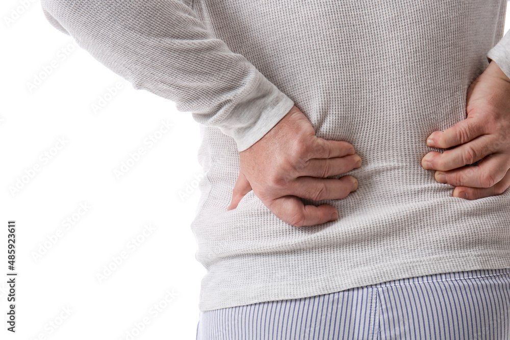 Senior man in sweater suffering from back pain on white background, closeup