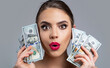 Woman with dollars in hand. Portrait woman holding money banknotes. Girl holding cash money in dollar banknotes. Woman holding lots of money in dollar currency. Luxury, beauty and money concept