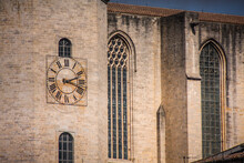 Detail Of Clock On  Girona Cathedral Of Saint Mary With Majestic Glass Windows And Stone Brick Walls.